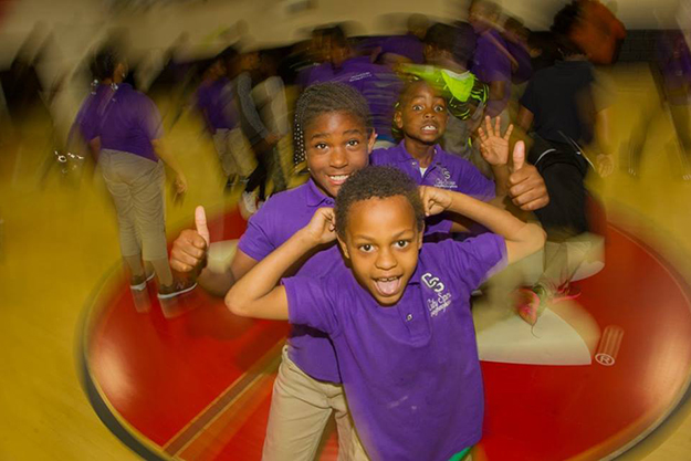 Students pose for the camera during activities
