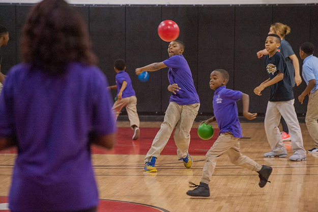 Living Classrooms students play dodgeball with volunteers