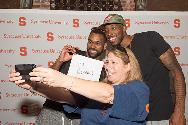 Linda Epstein '89 takes a selfie with some Boeheim's Army players